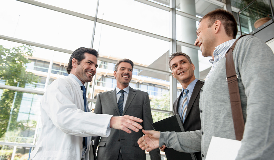 Locum physician and consultants shaking hands