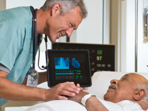 Local locums - Doctor speaking with elderly patient in hospital